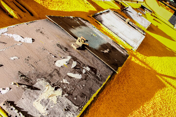 old iron doors on a bright yellow wall