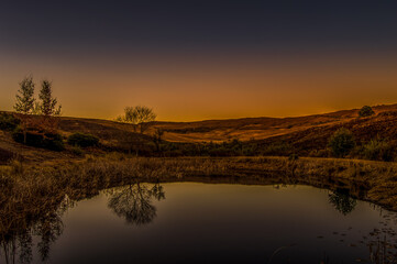 Fototapeta na wymiar A beautiful lake at sunset in Underberg in South Drakensberg South Africa