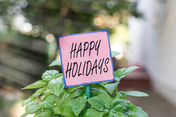 Writing note showing Happy Holidays. Business concept for observance of the Christmas spirit...