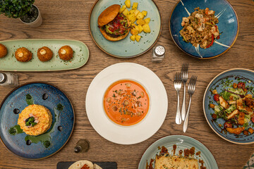 Mediterranean dishes on dark wooden table