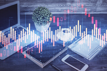 Double exposure of financial graph drawing and cell phone background. Concept of forex trading