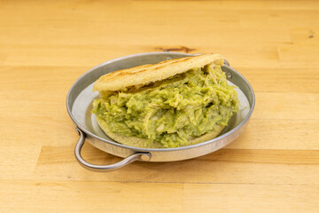 Venezuelan arepa on wooden table