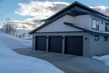 Garage entrance of a home on the scenic snowy terrain of Wasatch Mountains