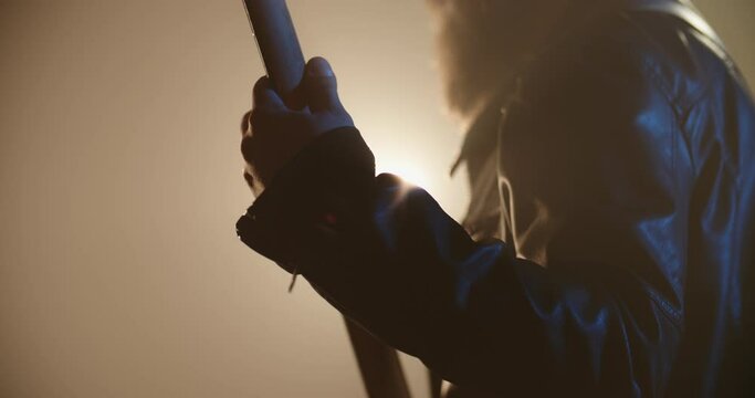 Close-up of bass player making a solo. An experienced musician starring on stage with rock music, lit by red and blue neon lights - music, hobby concept 4k footage