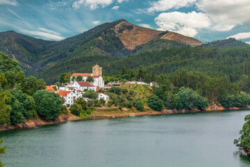 Fototapeta na wymiar Scenic view of templar village and castle by the river - Dornes, Portugal