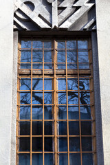 Fototapeta premium Cracow, Poland, Art-Noveau sculpted window in a abandoned old building.