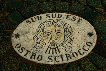 The marble symbol with the direction of the wind on the St. Peter's Square pavement, Vatican.