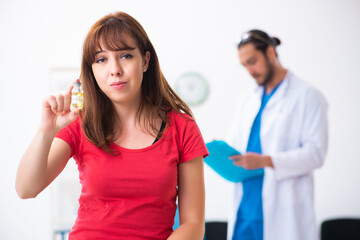 Female diabetic patient visiting young male doctor