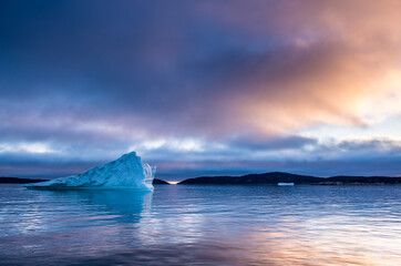 Iceberg at sunset in the Disco Bay, Greenland. Their source is by the Jakobshavn glacier.