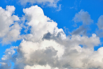 Naklejka na ściany i meble Big clouds in the blue sky summertime.