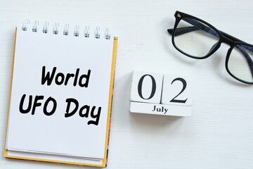 2th july World UFO Day second of month calendar concept on wooden blocks.