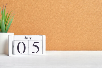 5th july fifth day of month calendar concept on wooden blocks with copy space.
