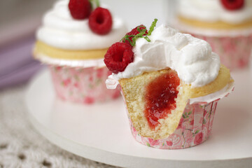 lemon cupcake with whipped cream and raspberry filling