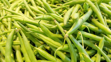 Close up of long green beans ready for sale in farmer market