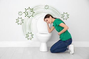Young woman suffering from nausea at toilet bowl and bacteria illustration. Food poisoning