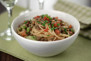 whole-grain spaghetti in a sauce of lentils, tomatoes, celery and herbs