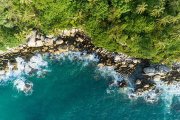 Aerial view of crashing waves on rocks landscape nature view and Beautiful tropical sea with Sea coast view in summer season image by Drone High angle view.