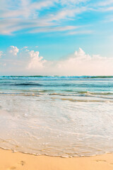 Fototapeta na wymiar Tropical seascape. Blue sky and clear ocean water on sandy beach.