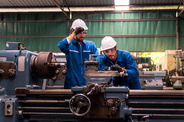 Engineers and skilled technicians are maintaining machinery. Engineers are working and repairing...