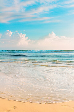 Tropical seascape. Blue sky and clear ocean water on sandy beach.