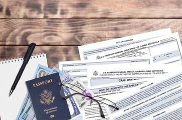 Department of State form DS82 U.S. Passport renewal application for eligible individuals lies on table and ready to fill. Paperwork during operations with US Passport concept - obrazy, fototapety, plakaty