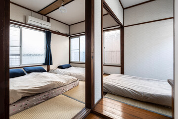 Three mattresses in the bedroom at an old wooden house