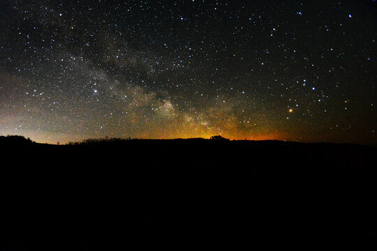 The Milky Way rising over cliffs at Blackgang Chine, Isle of Wight, UK.