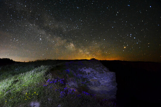 The Milky Way rising over cliffs at Blackgang Chine, Isle of Wight, UK.