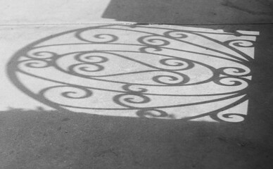 black and white shadow of ornamental gate