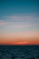A hazy view of the sunrise over the sea