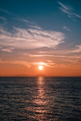 A hazy view of the sunrise over the sea