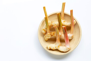 Fresh galangal isolated on white.