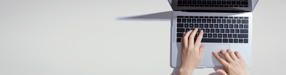 Person using a laptop computer from above