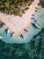 Aerial photos of Guyam Island, a tear-drop shaped island in the Philippine Sea situated around 2 kilometres south-southeast of General Luna municipality. Popular stop for tourists doing island-hopping
