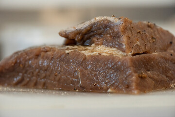 raw marinated meat pastrami close up