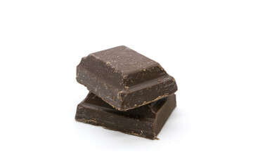Broken black chocolate bar isolated on white background