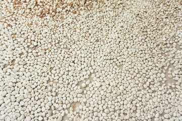 white pebbles stone texture background. Naturally polished white rock pebbles background