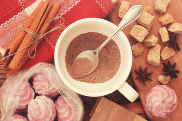 Dry soluble coffee or cappuccino drink in cup with blueberry marshmallow zephyr and cane sugar. Top...