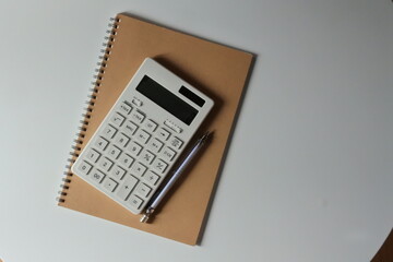 studying or household accounting or working - a calculator, a pen and a notebook