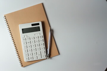 studying or household accounting or working - a calculator, a pen and a notebook