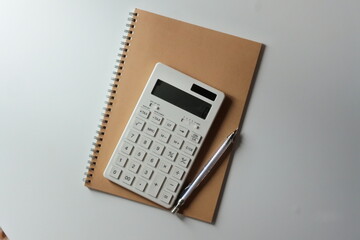 studying or household accounting or working - a calculator, a pen and a notebook