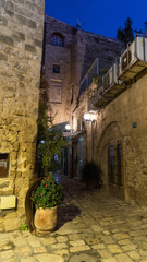 White stone house on narrow street of Old Yafo (Jaffa) at night. Tel Aviv, Israel.