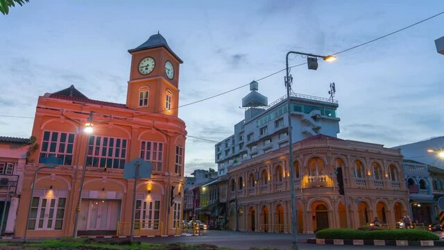time lapse sunset behind the old architectural style in Phuket city.the clock tower was built in Chino portuguese style.
