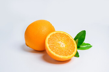 Fresh Orange fruit isolated on white back ground. Orange slice and green leaf.