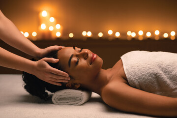 Peaceful african woman attending luxury spa salon