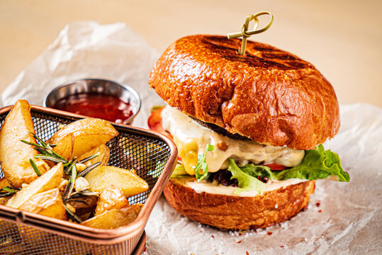 burger with tomato sauce and baked potato