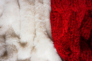 Red wool texture and white texture close up, cotton wool, red and white fabric, beige fluffy fur