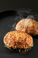 鉄板で焼くハンバーグステーキ　Japanese hamburg steak grilled on an iron plate
