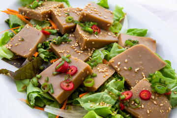 Seasoned Acorn Jelly Salad which is called Muk made of buckwheat