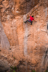A strong man climbs a rock, Rock climbing in Turkey.